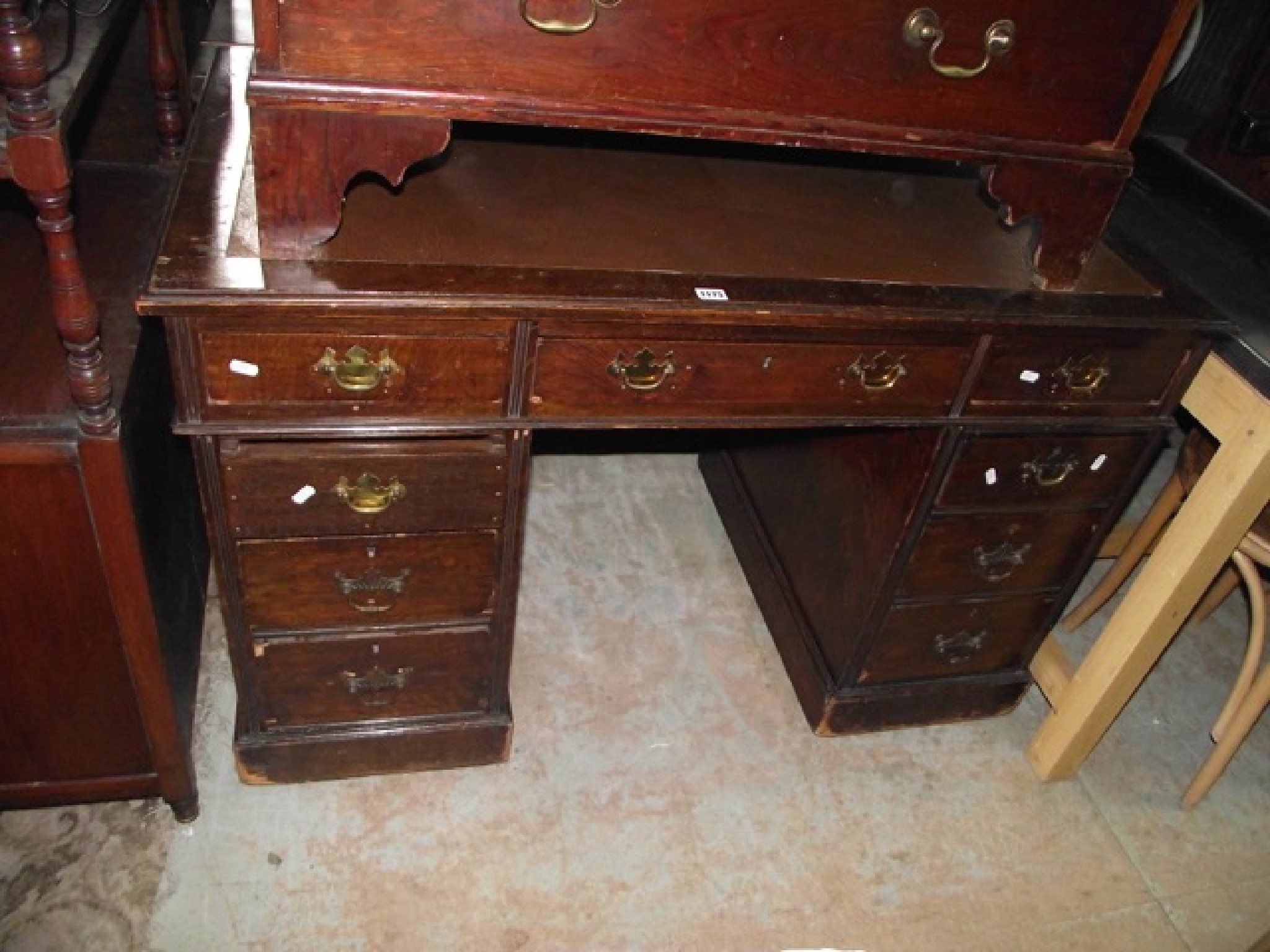 Appraisal: A late th early th century stained oak kneehole twin