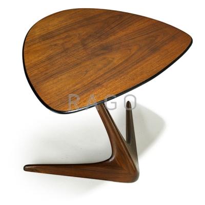 Appraisal: VLADIMIR KAGAN b KAGAN-DREYFUSS Sculpted and laminated walnut side table