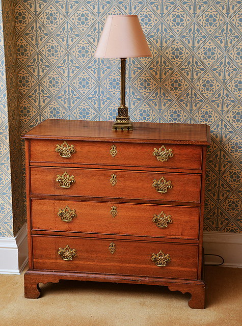 Appraisal: A GEORGE III OAK CHEST of four long drawers with