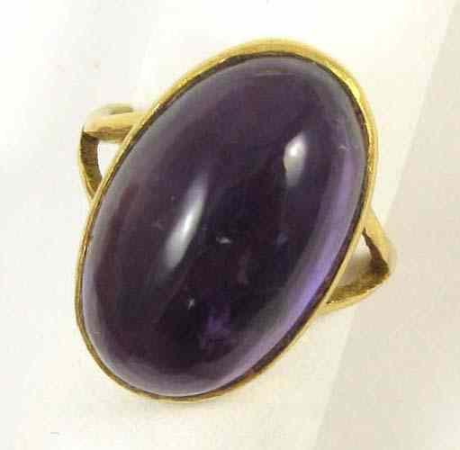 Appraisal: AMETHYST AND FOURTEEN KARAT GOLD RING set with a large