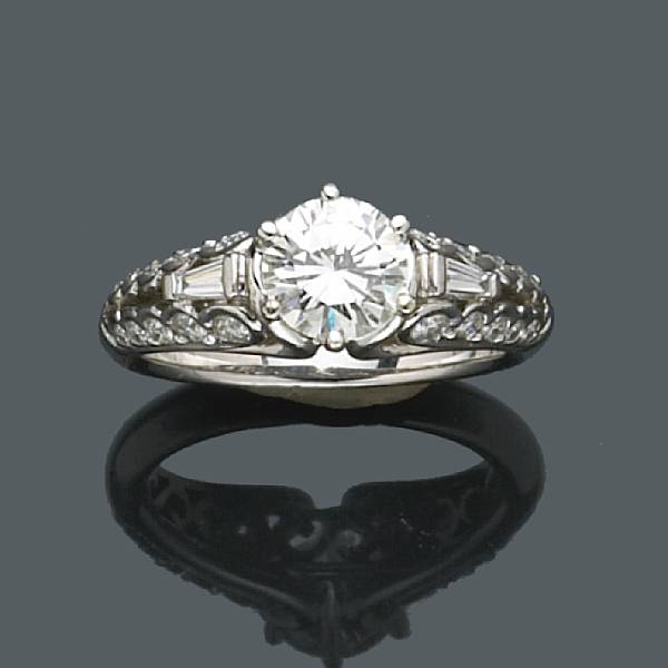 Appraisal: A diamond ring centering a round brilliant-cut diamond weighing an