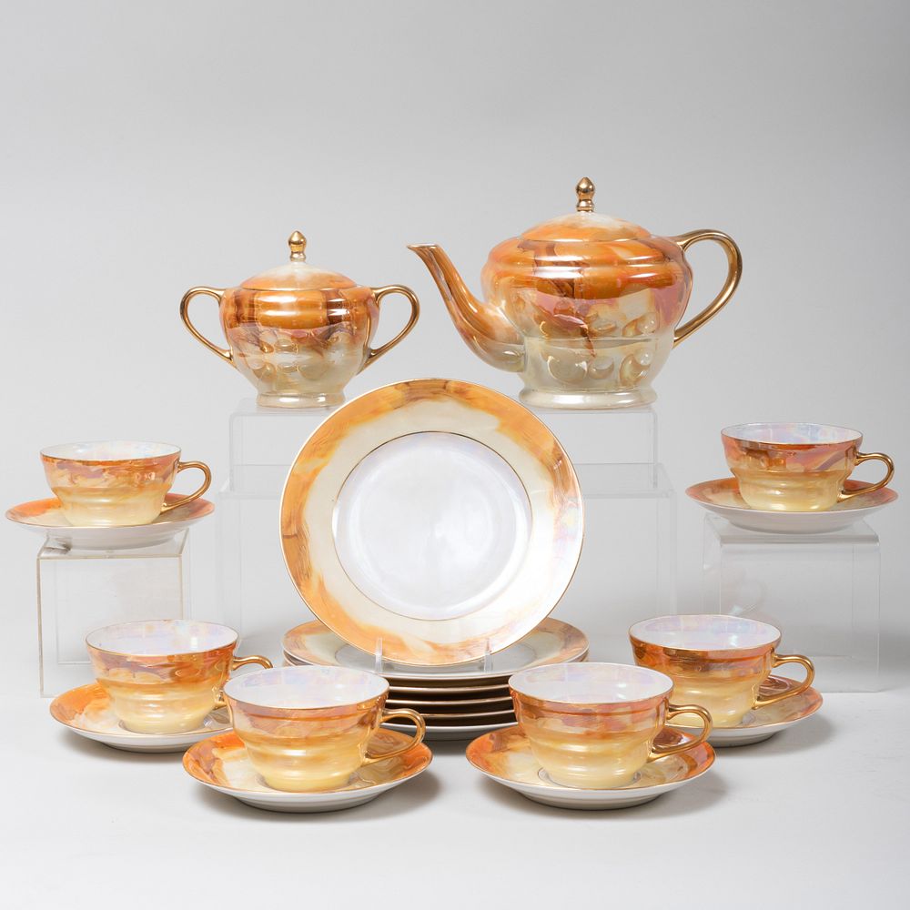 Appraisal: Czechoslovakian Luster Glazed Porcelain 'Faux Marble' Tea Service Orange printed