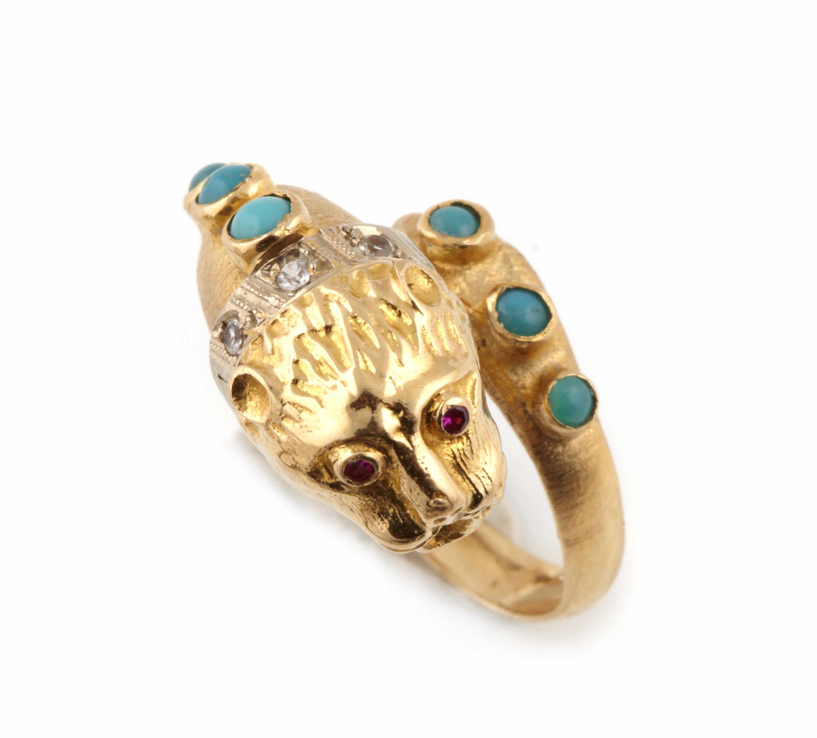 Appraisal: A gem-set and bicolor gold cougar ring approximate size