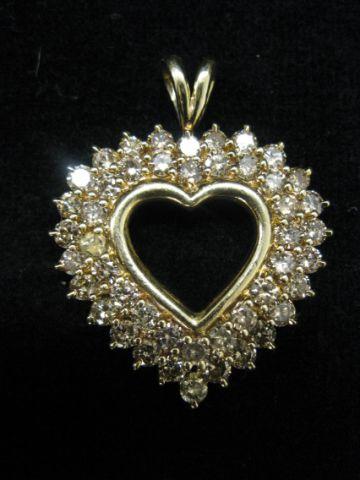 Appraisal: Diamond Heart Pendant carats of fancy champagne color round diamonds