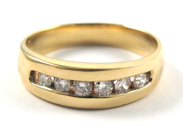 Appraisal: MAN'S DIAMOND AND FOURTEEN KARAT GOLD RING set with a