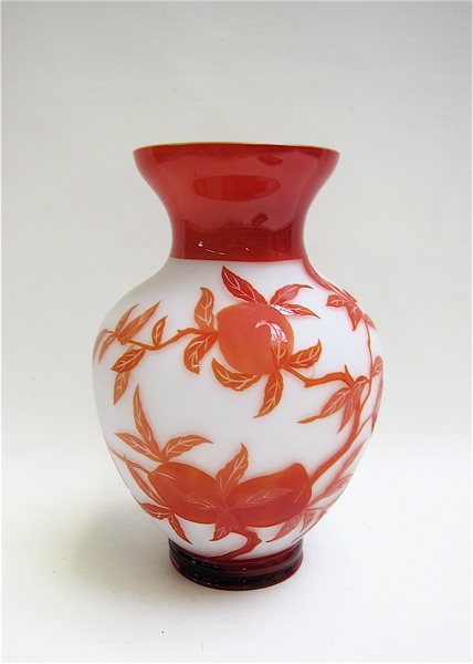 Appraisal: CHINESE CARVED PEKING CAMEO GLASS VASE with orange fruiting peach