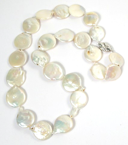 Appraisal: PEARL MATINEE LENGTH PEARL NECKLACE strung with coin pearls coming