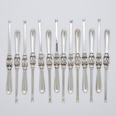 Appraisal: FOURTEEN GEORG JENSEN SILVER ACORN LOBSTER PICKS Designed by Johan