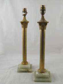 Appraisal: A pair of gilt Corinthian column table lamps on stepped