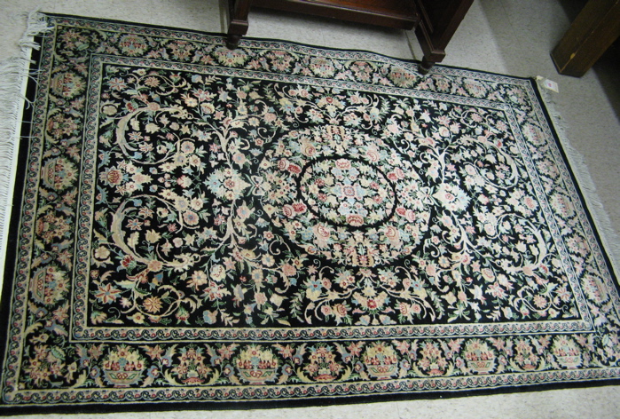 Appraisal: HAND KNOTTED ORIENTAL AREA RUG floral and floral medallion design