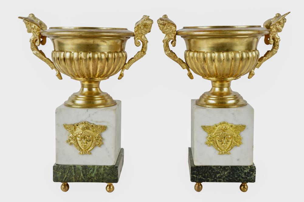 Appraisal: PAIR OF FRENCH EMPIRE STYLE DORE BRONZE URNS ON MARBLE