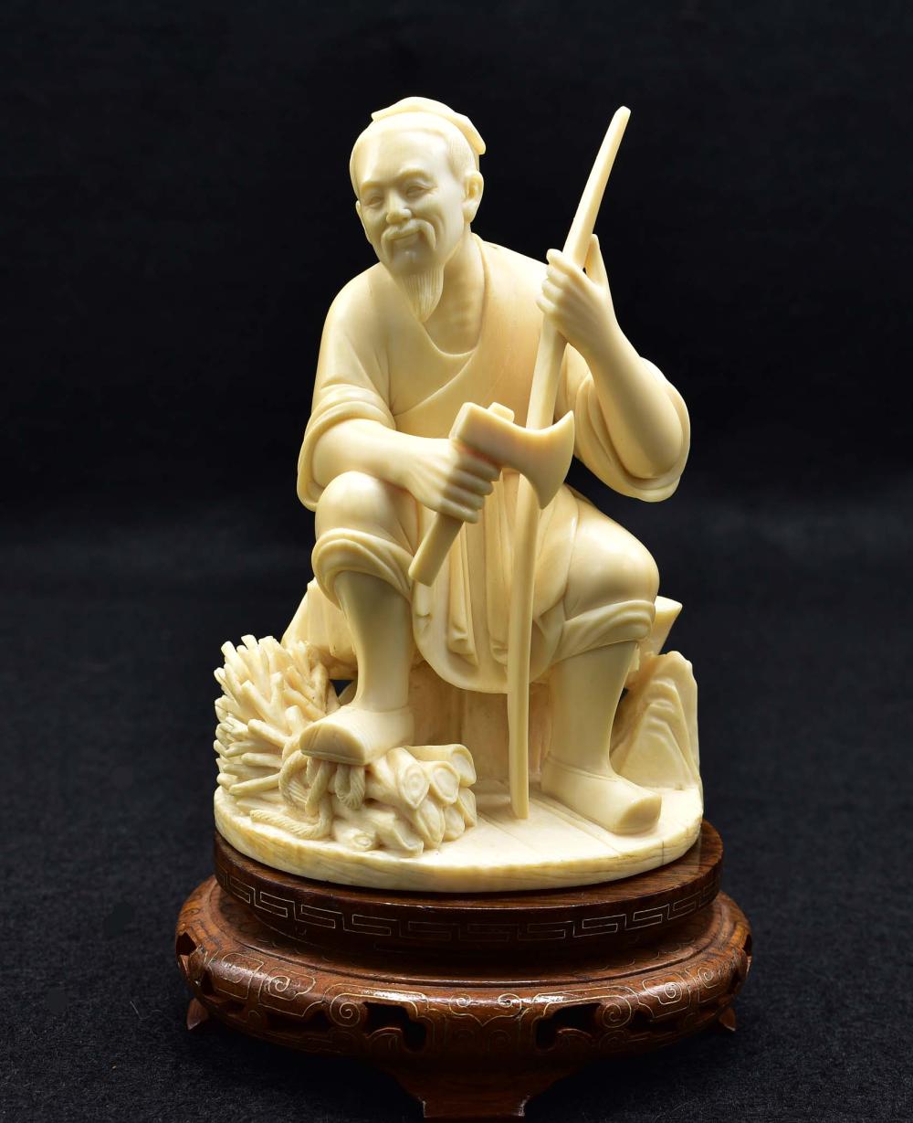 Appraisal: CHINESE CARVING OF AN ELDERLY WOOD CHOPPERThe bearded gentleman seated