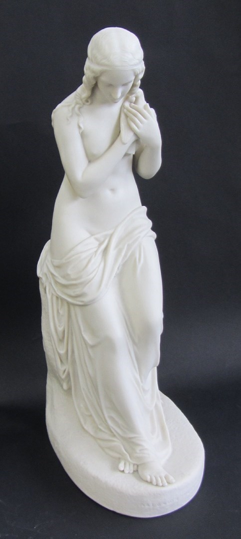 Appraisal: A Copeland parian figure 'Innocence' raised atop a naturalistic oval