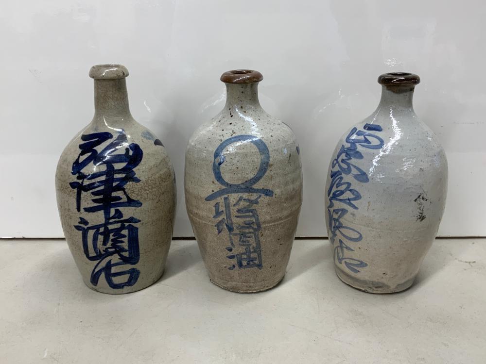 Appraisal: Three Japanese Blue and White Glazed Stoneware Sake Bottles H