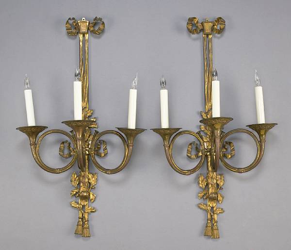 Appraisal: A set of four Neoclassical style gilt bronze three light