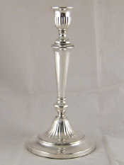 Appraisal: A single white metal tests silver cased candlestick in the