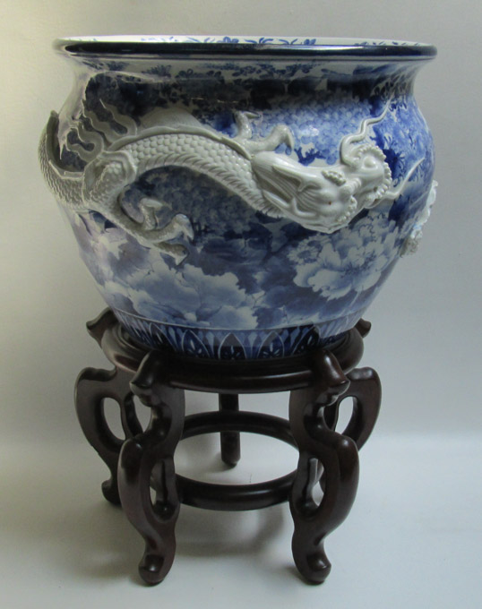 Appraisal: JAPANESE BLUE AND WHITE PORCELAIN JARDINIERE AND WOOD STAND The