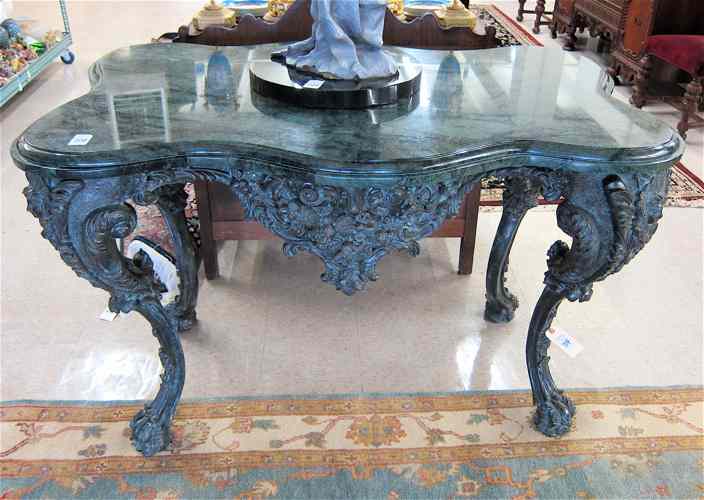 Appraisal: RENAISSANCE STYLE MARBLE-TOPPED BRONZE CENTER TABLE the conformingly shaped verde