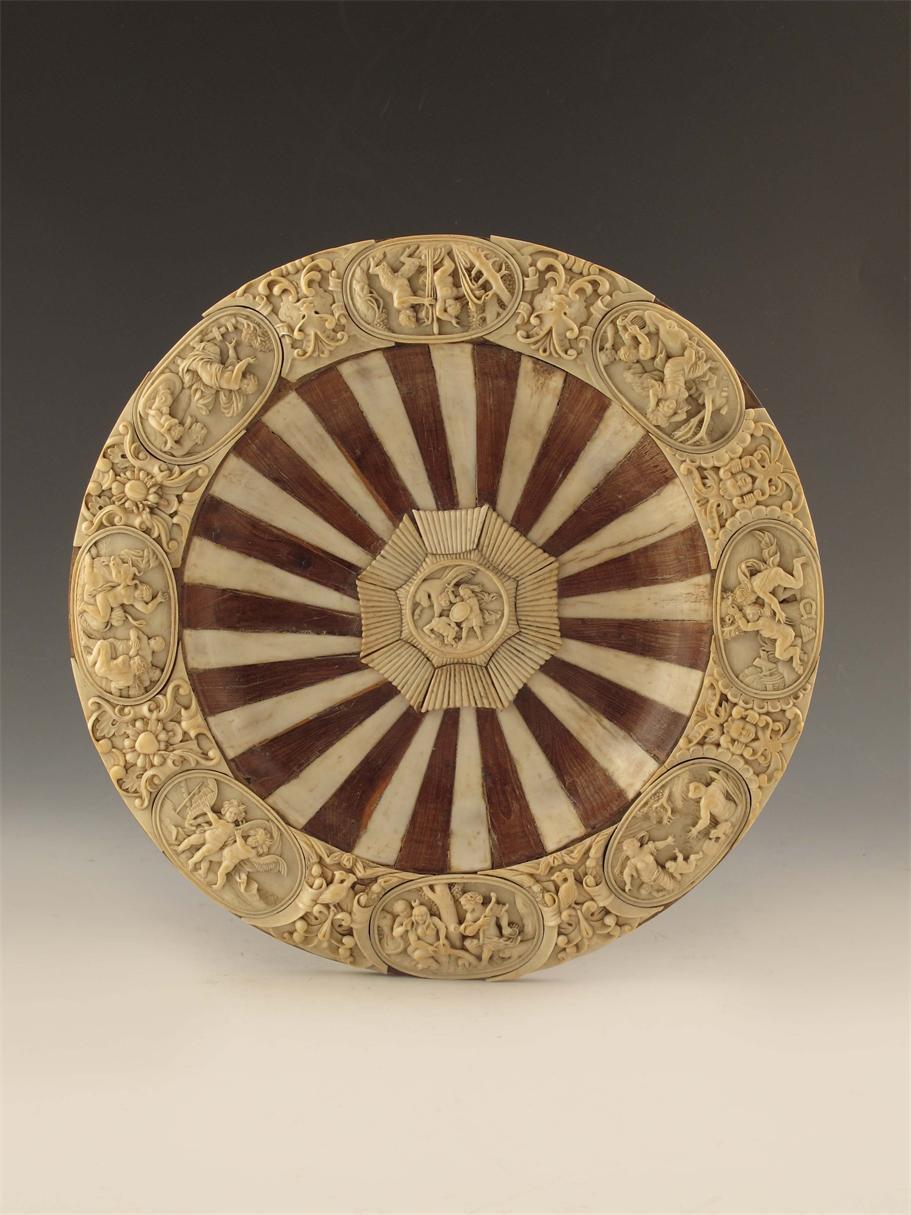 Appraisal: A German carved ivory and wood shallow bowl