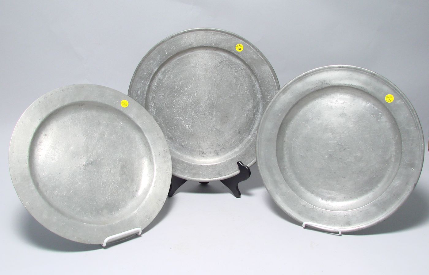 Appraisal: THREE ANTIQUE ENGLISH PEWTER CHARGERS All show restorations Diameters approximately