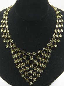 Appraisal: A yellow metal tests carat gold and peridot fringe necklace