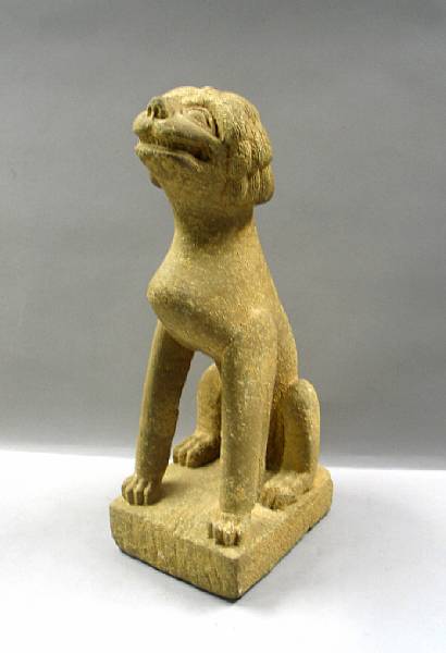 Appraisal: A Chinese stone dog With its jaws open the dog