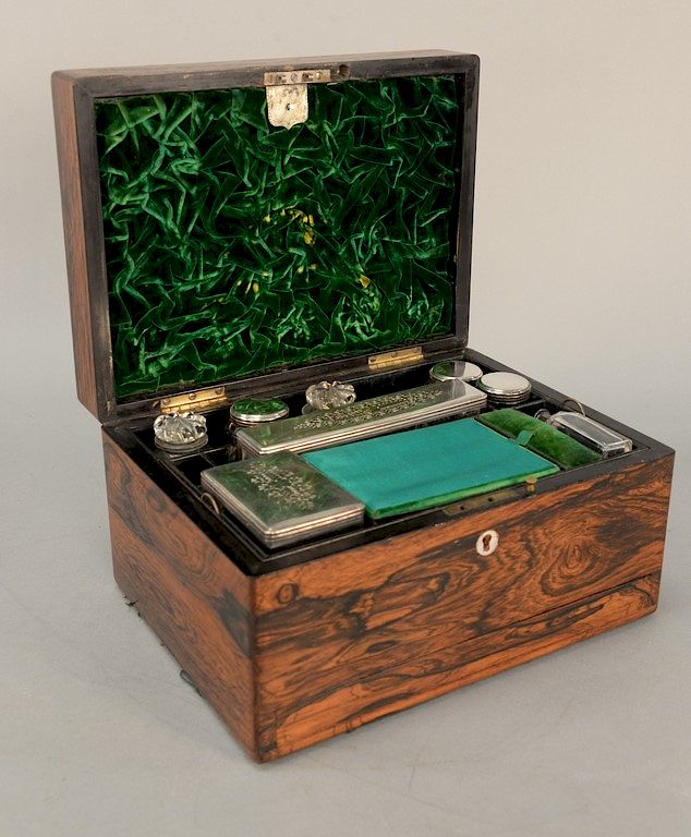 Appraisal: Rosewood travel box with fitted interior having bottles and containers