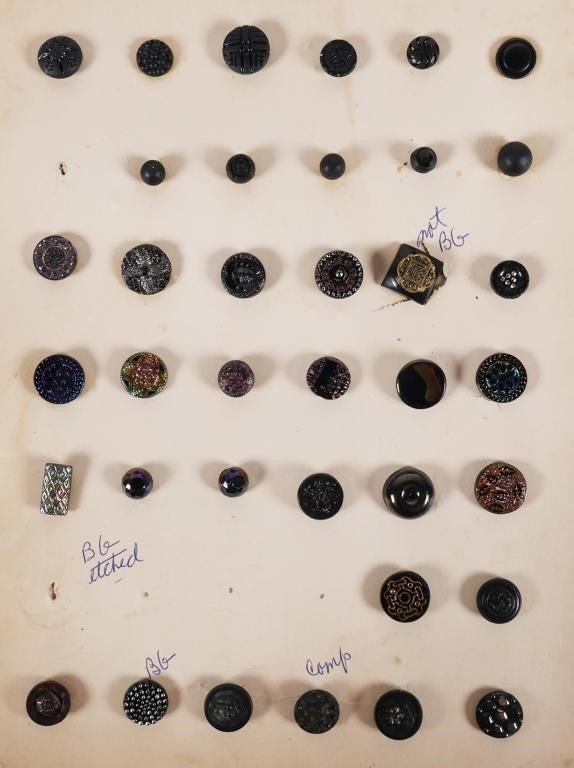 Appraisal: Collection of black glass raised relief buttons some are composite