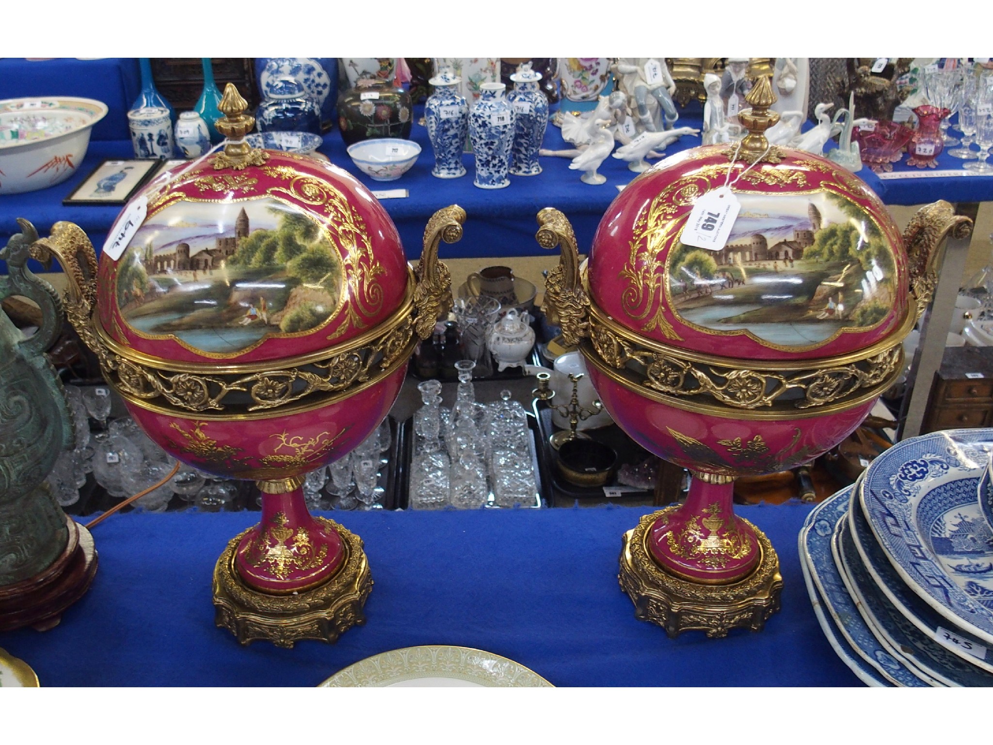 Appraisal: Pair of spherical urns and covers with metal mounts and