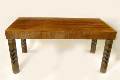 Appraisal: An Art Deco rosewood veneer and dinanderie table the design