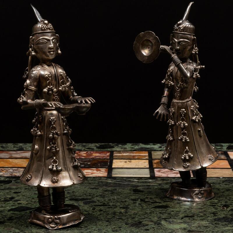 Appraisal: Pair of Indian Silvered-Metal Models of Musicians Unmarked The larger