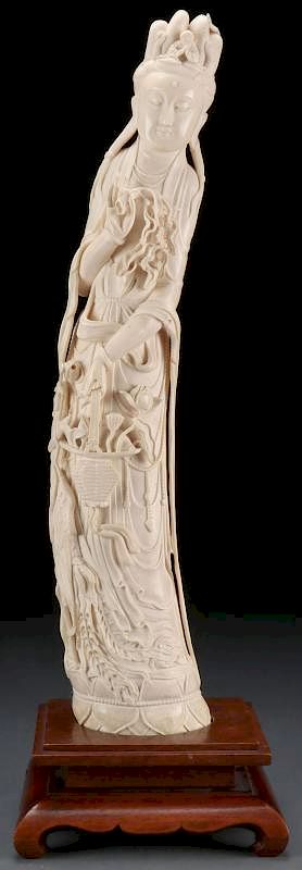 Appraisal: A LARGE CHINESE CARVED IVORY KWAN-YIN TUSK EAR A LARGE