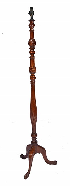 Appraisal: A ROSEWOOD LAMP STANDARD with wrythen turned slender baluster column