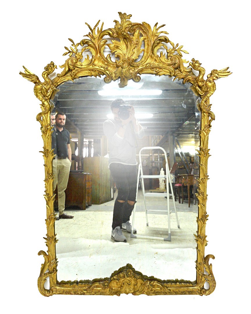 Appraisal: A th century gilt framed arch top wall mirror the