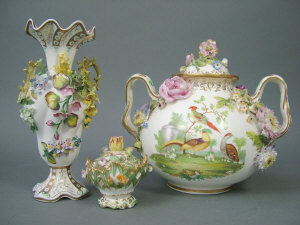 Appraisal: Coalport flower encrusted twin-handled vase and cover of globular form