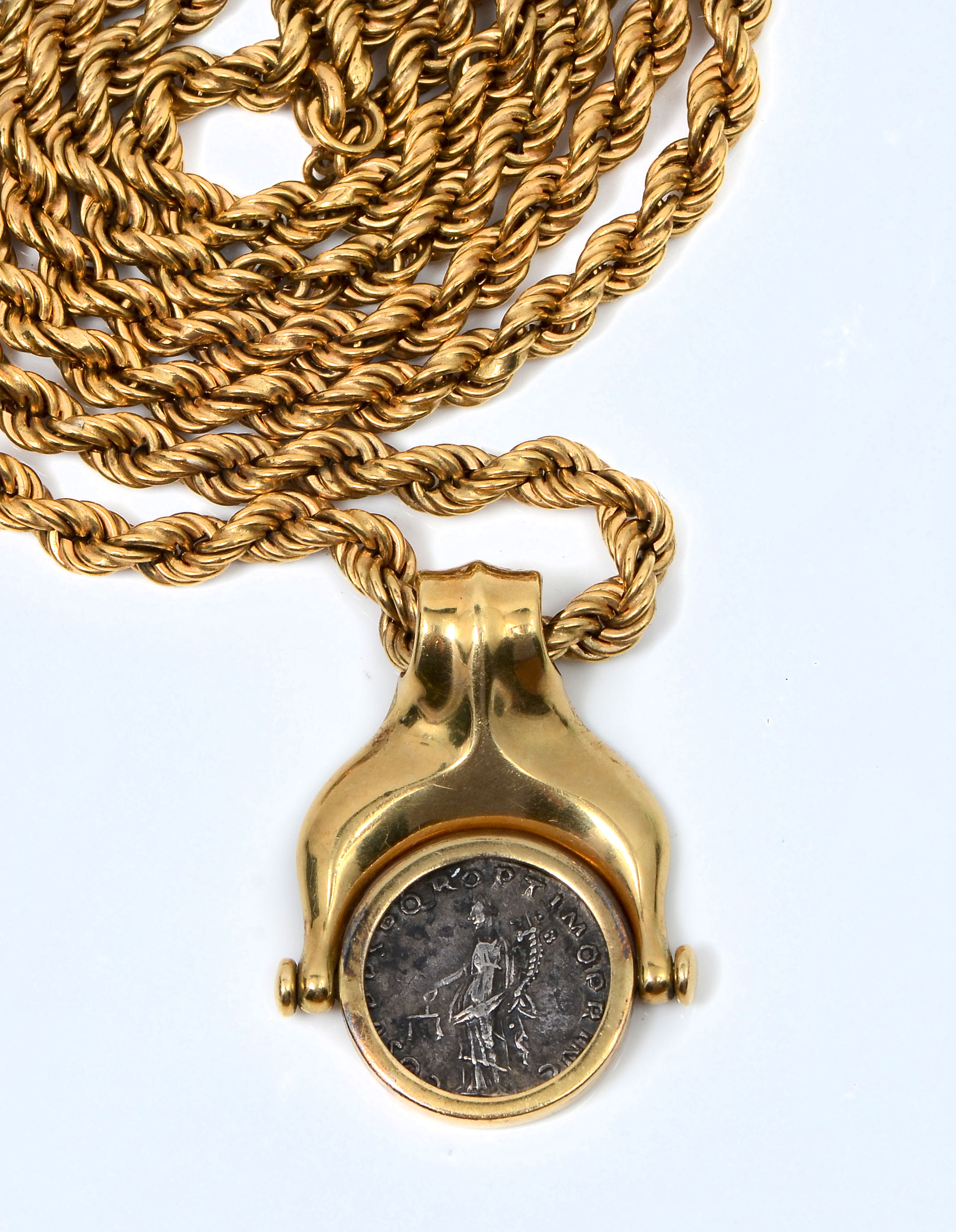 Appraisal: GRAM ROMAN COIN IN K PENDANT ROPE NECKLACE Roman coin