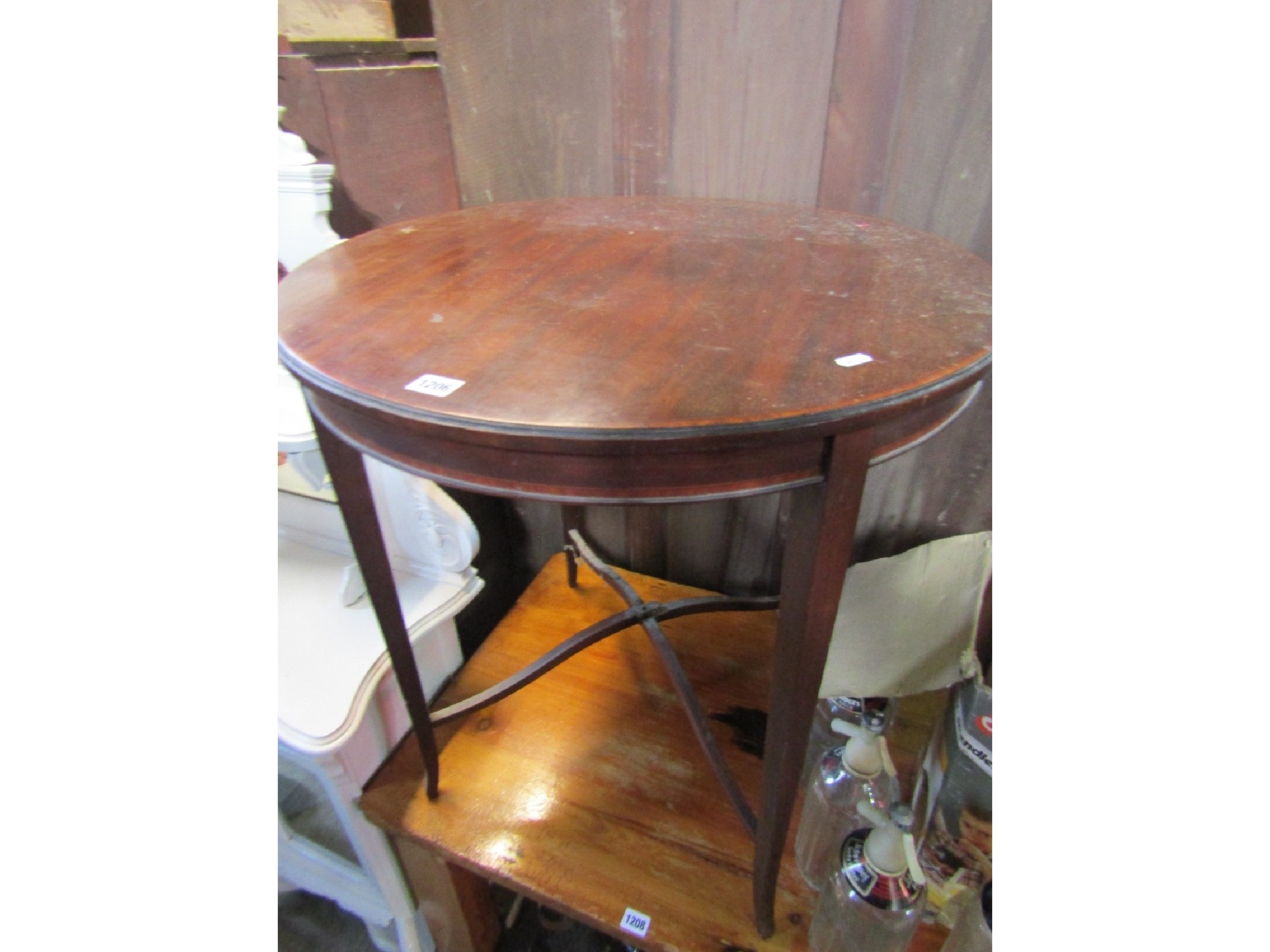 Appraisal: An inlaid Edwardian mahogany occasional table of circular form with