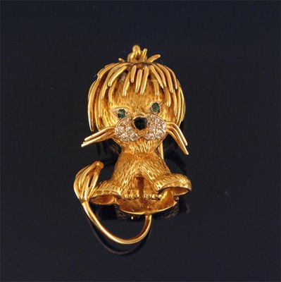 Appraisal: A gold lion brooch pendant set with small diamonds black