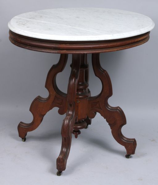 Appraisal: th Century Victorian walnut marble top table with original custers