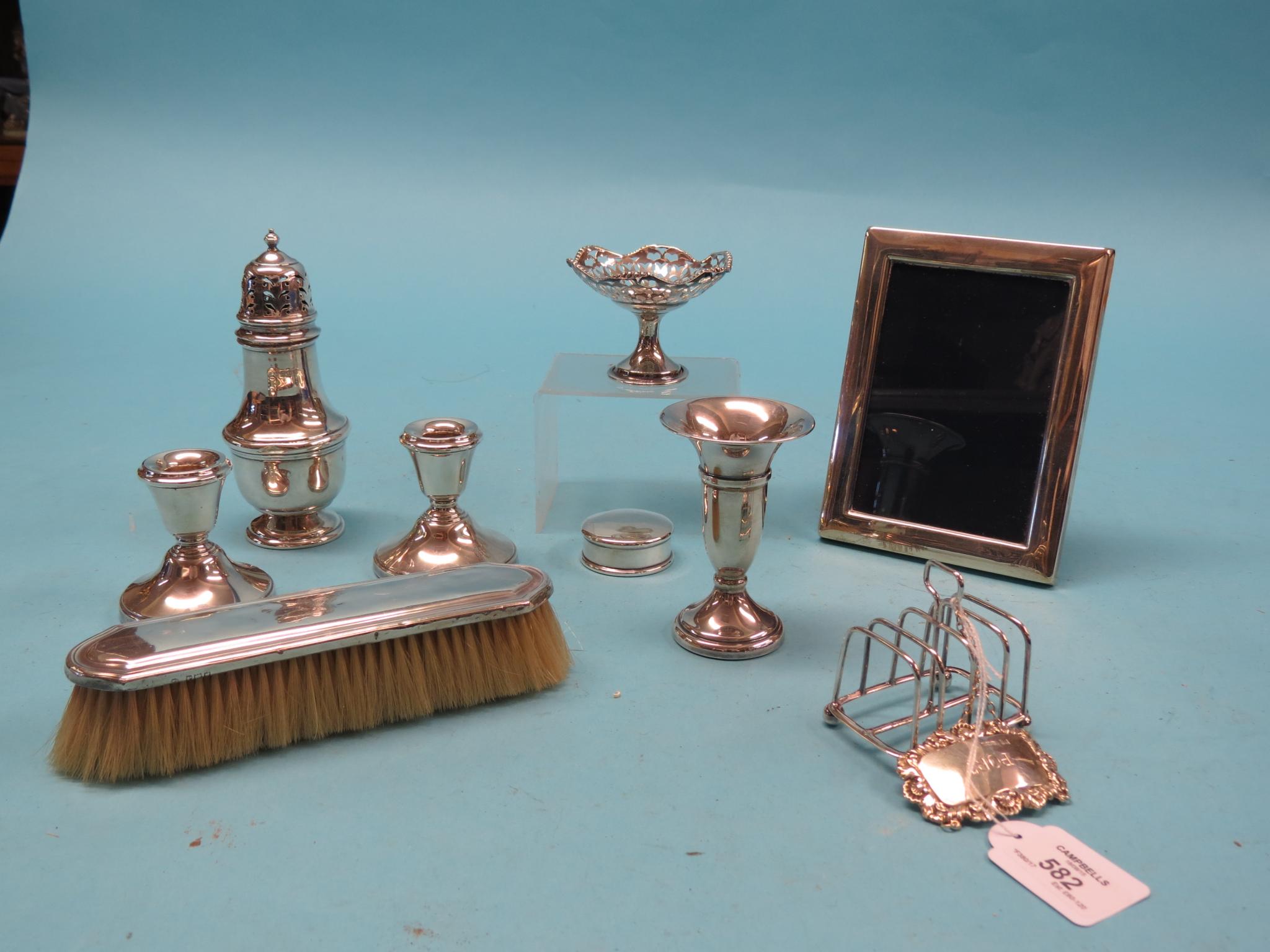 Appraisal: Small silverware sugar caster photograph frame pair of candlesticks vase