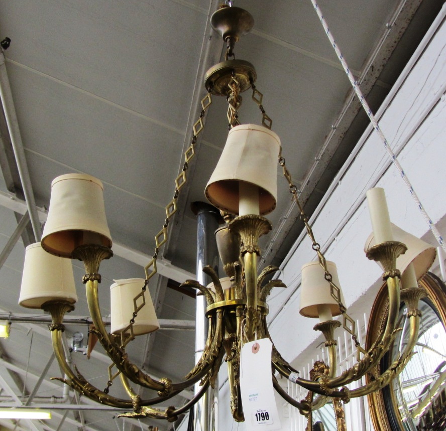 Appraisal: A French bronze and parcel gilt chandelier and two matching