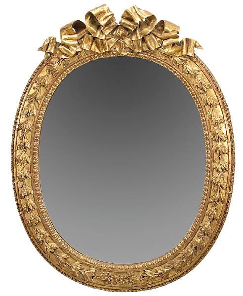 Appraisal: A Louis XVI style giltwood oval mirror th century The