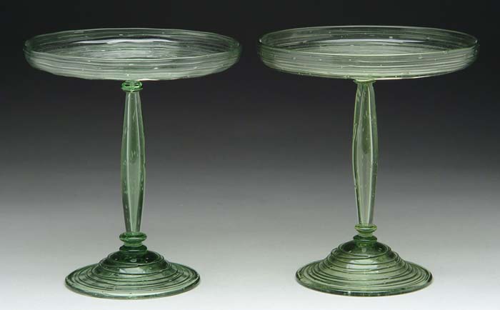 Appraisal: PAIR OF STEUBEN COMPOTES Pomona green glass with applied threading