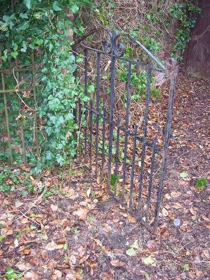 Appraisal: A wrought iron garden gate cm wide and two lengths