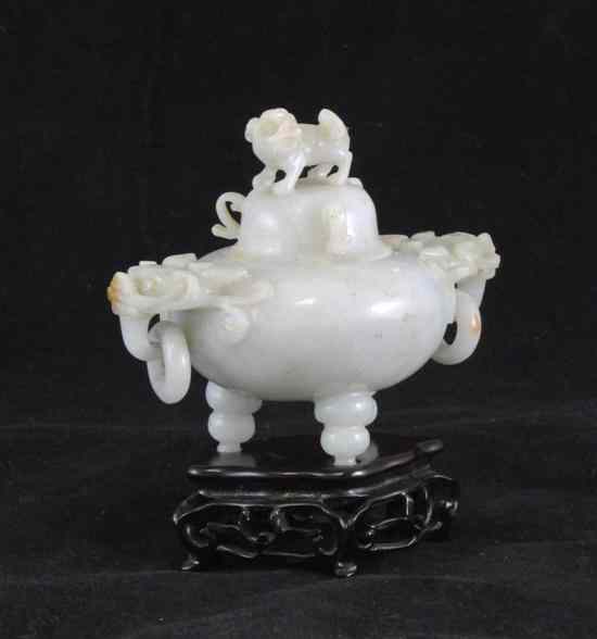 Appraisal: A Chinese white jadeite tripod censer gui and cover with