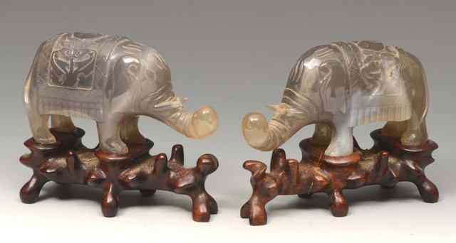 Appraisal: A PAIR OF CHINESE CHALCEDONY MODEL STANDING ELEPHANTS each on