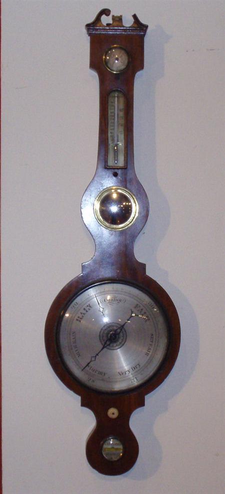 Appraisal: A George III mahogany banjo barometer of serpentine form with