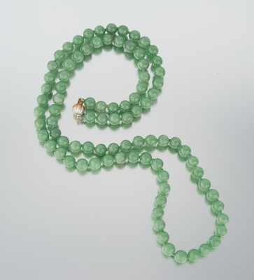 Appraisal: A Carved Jade Bead Necklace k yellow and white gold