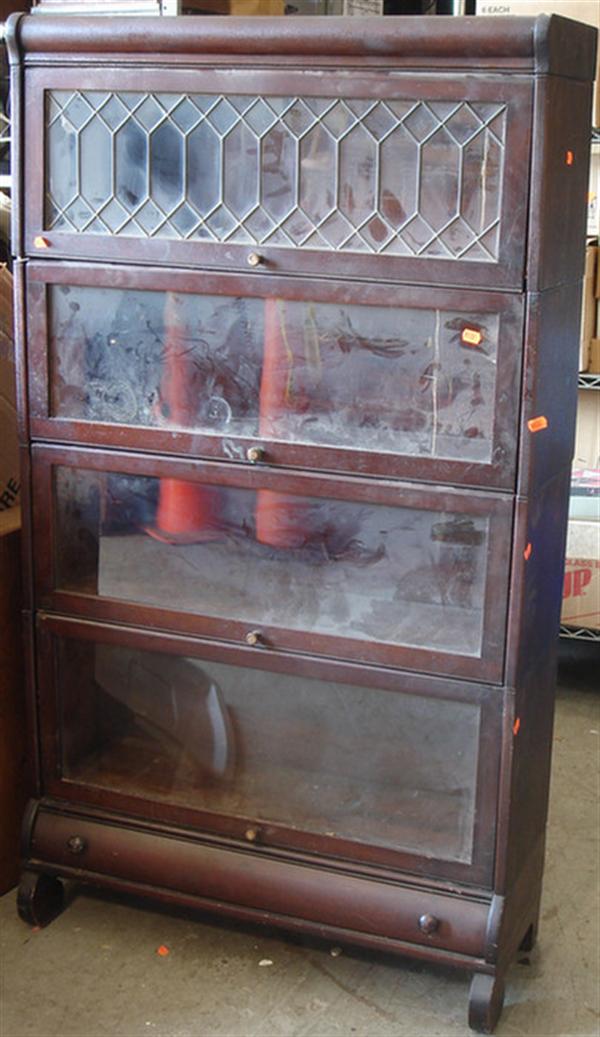 Appraisal: section mahogany finished stacking barrister bookcase leaded top section drawer