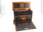 Appraisal: A hardwood stationery box with fall front and lift up